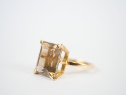 18K yellow gold ring set with a large faceted...