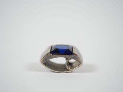 Freeform silver pendant adorned with a square...