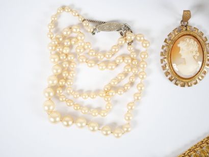 Costume jewelry set including: four necklaces,...