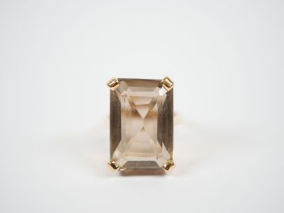 18K yellow gold ring set with a large faceted...