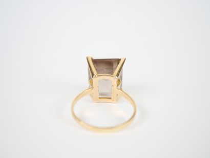 18K yellow gold ring set with a large faceted...
