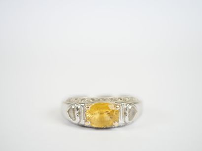 18K white gold ring centered on a probable...