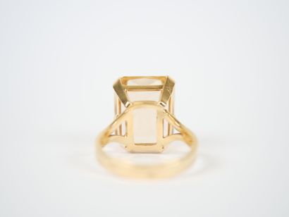 18K yellow gold ring featuring a large faceted...