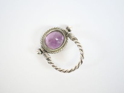Likely to form a silver ring, with a stylized...