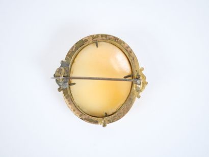 Oval gilt-metal brooch featuring a cameo...