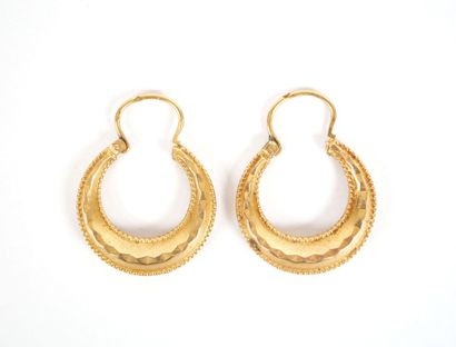 Pair of faceted hoop earrings in 18K yellow...