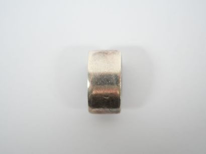 Freeform silver pendant adorned with a square...