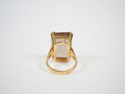 18K yellow gold ring set with a large faceted...