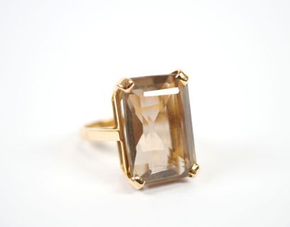 18K yellow gold ring set with a large faceted...