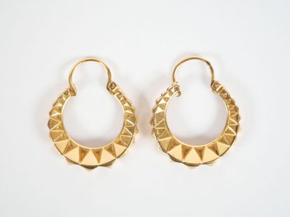 Pair of faceted hoop earrings in 18K yellow...