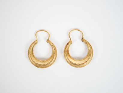 Pair of faceted hoop earrings in 18K yellow...