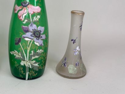 Three colored and enameled glass vases with...