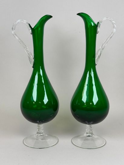 Pair of large ewers in partially colored...