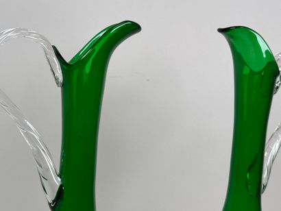 Pair of large ewers in partially colored...