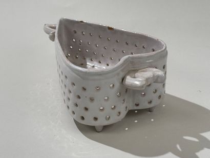 Openwork white earthenware cheese mold decorated...