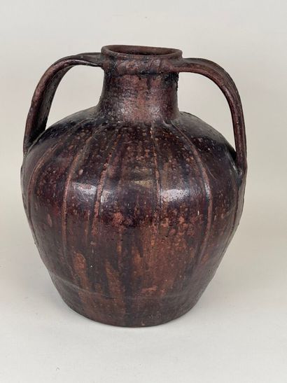 Large oil jar in glazed terra cotta.
H. 33...