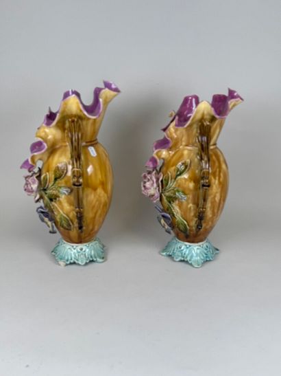 Pair of polychrome barbotine vases with two...