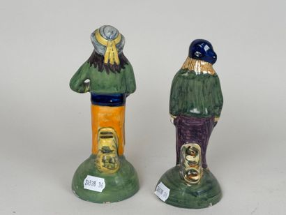 HENRIOT QUIMPER.
Two Breton figures in polychrome...