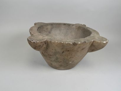 Large marble mortar with four ears, one of...