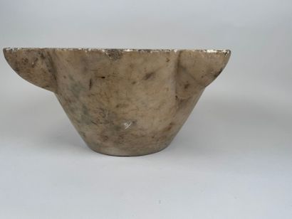 Large marble mortar with four ears, one of...
