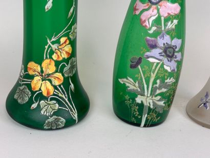 Three colored and enameled glass vases with...
