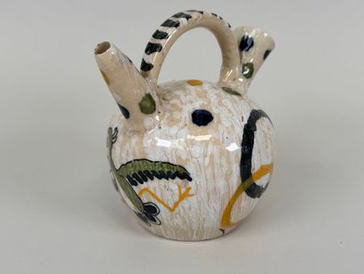 Petit pichet en faïence polychrome à décor...