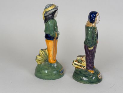 HENRIOT QUIMPER.
Two Breton figures in polychrome...