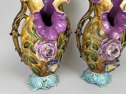 Pair of polychrome barbotine vases with two...