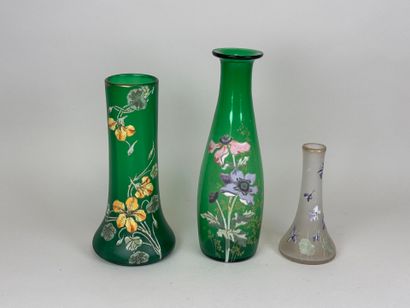 Three colored and enameled glass vases with...