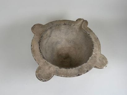Large marble mortar with four ears, one of...