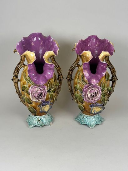 Pair of polychrome barbotine vases with two...