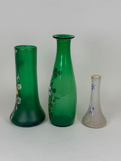 Three colored and enameled glass vases with...