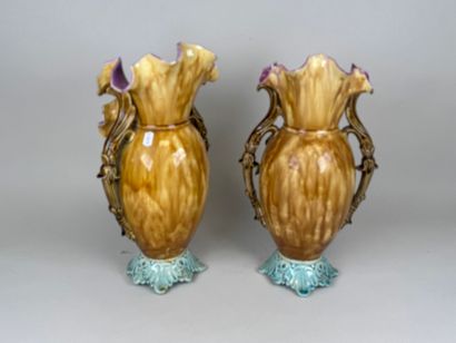Pair of polychrome barbotine vases with two...