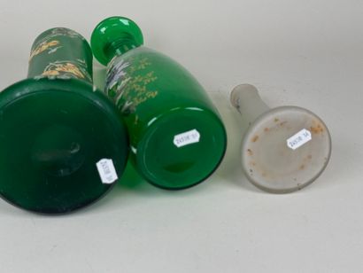 Three colored and enameled glass vases with...