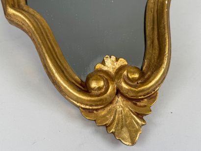 Gilded wood mirror decorated with a stylized...
