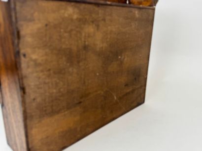 Small pipe cabinet in stained wood opening...