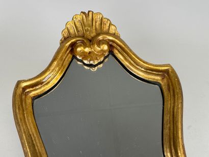 Gilded wood mirror decorated with a stylized...