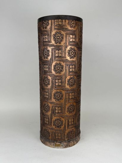 Embossed metal umbrella stand decorated with...