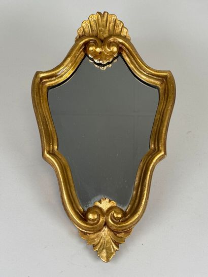 Gilded wood mirror decorated with a stylized...
