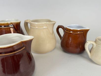 Seven small ceramic milk jugs.
H. 11.5 cm...