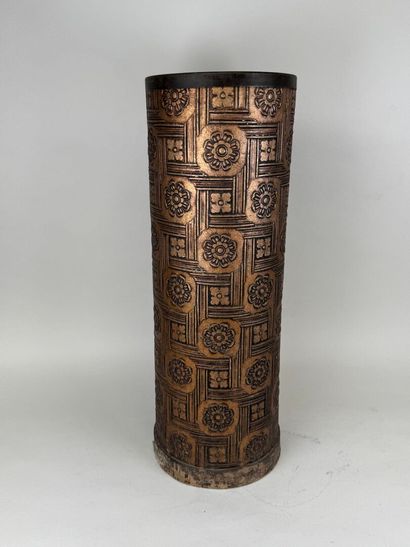 Embossed metal umbrella stand decorated with...