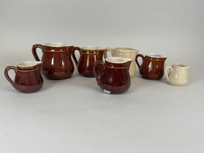 Seven small ceramic milk jugs.
H. 11.5 cm...