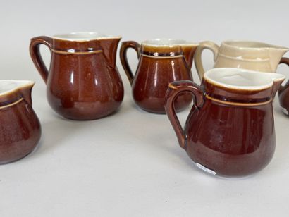 Seven small ceramic milk jugs.
H. 11.5 cm...