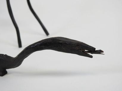 Cerf et serpent en fer forgé laqué noir.
Travail...