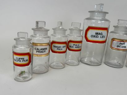8 clear glass medicine jars.
H. 13-16-19-24...