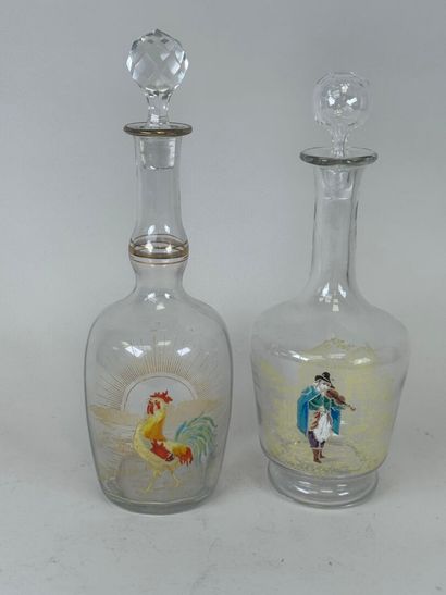 Deux carafes en verre à décor émaillé et...