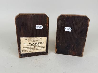 A pair of bookends in wood and gilded stucco,...