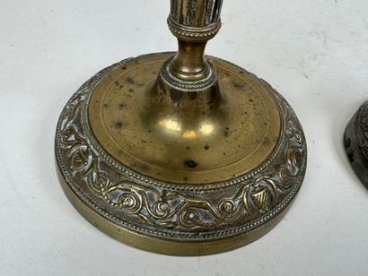 Two ormolu torches, one decorated with vases...