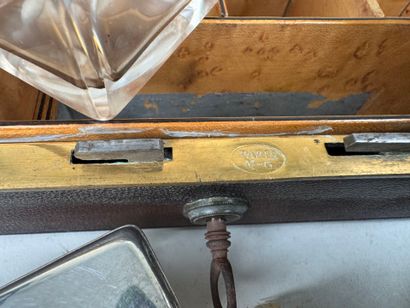 Brown leather travel case, numbered on the...