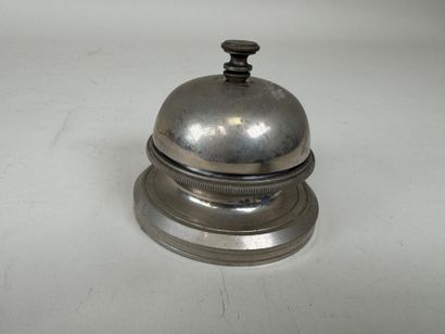 Circular metal table bell.
D. 8.5 cm.
(w...